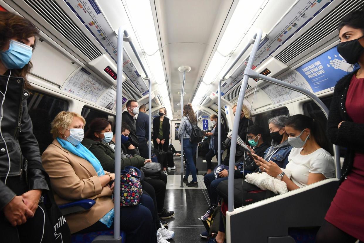 Passengers ride in an Underground train during the rush hour in London on Wednesday: PA