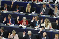 Brexit Party leader Nigel Farage, left middle row, and other Parliament Members vote a resolution for the UK withdrawal from the EU, Wednesday, Sept. 18, 2019 in Strasbourg. Members of the European Parliament discuss the current state of play of the UK's withdrawal from the EU. (AP Photo/Jean-Francois Badias)