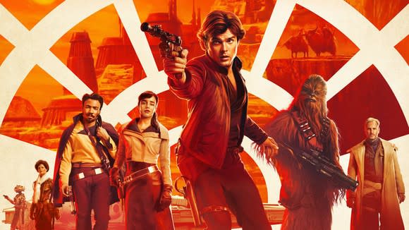 A movie poster for Solo: A Star Wars Story. Various characters from the movie stand behind a young Han Solo.