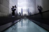 A firefighter memorial bagpiper visits the 9/11 Empty Sky memorial during the 13th anniversary of the 9/11 attacks on the World Trade Center, in Jersey City, New Jersey, September 11, 2014. REUTERS/Eduardo Munoz