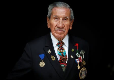 Charles Norman Shay, 94, a Penobscot Native American Indian WWII veteran, poses as he attends an interview with Reuters in Bretteville l'Orgueilleuse