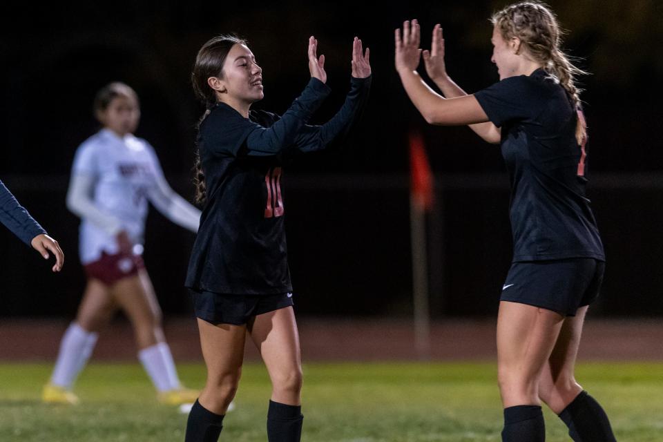 Oak Hills’ Aliyah Casillas, left, celebrates with Mollie Zielke after scoring a goal against Granite Hills on Tuesday, Dec. 12, 2023. Oak Hills beat Granite Hills by a score of 4-2.