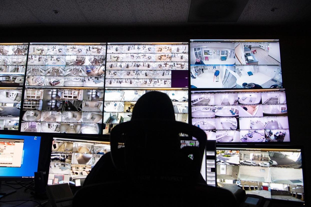 Monitors show the goings on of the Buncombe County Detention Facility December 2, 2021.