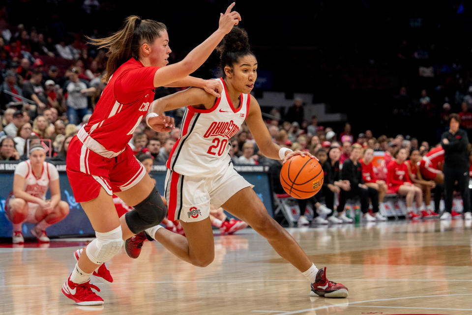 Nov 26, 2023; Columbus, OH, USA;
Ohio State Buckeyes guard Diana Collins (20) runs past Cornell Big Red guard Mia Beam (12) towards the basket during their game on Sunday, Nov. 26, 2023 at Value City Arena.