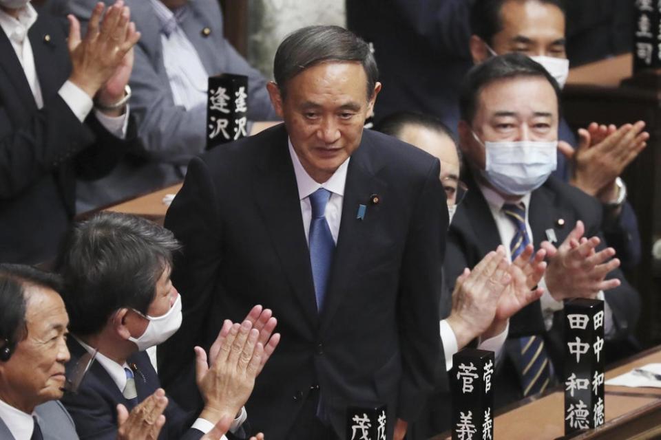 Yoshihide Suga, Japan’s prime minister, has said he will not run for re-election as party leader (AP)