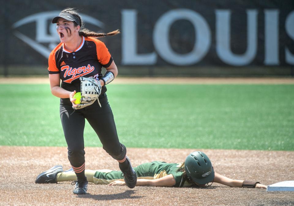 St. Bede's Bailey Engels lies flat on her face after getting tagged out by Illini Bluffs' shortstop Zoe Eeten in the second inning of the Class 1A softball state title game Saturday, June 3, 2023 at the Louisville Slugger Sports Complex in Peoria. The defending champion Tigers fell to the Lady Bruins 7-6.