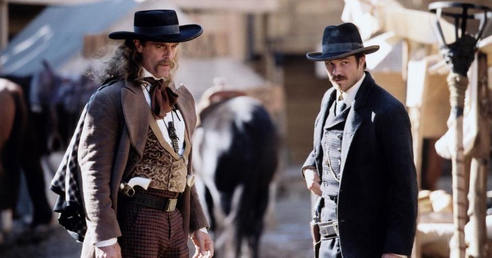 two men in 19th century western clothing