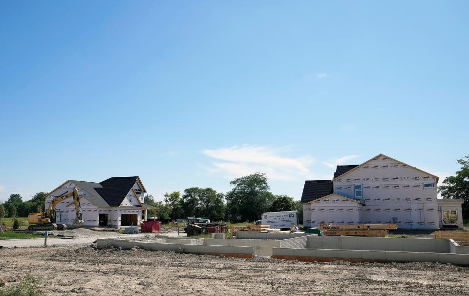 Construction of new houses in the new development of Pioneer Crossing by Pulte Homes up off of Rt. 42 in Plain City.