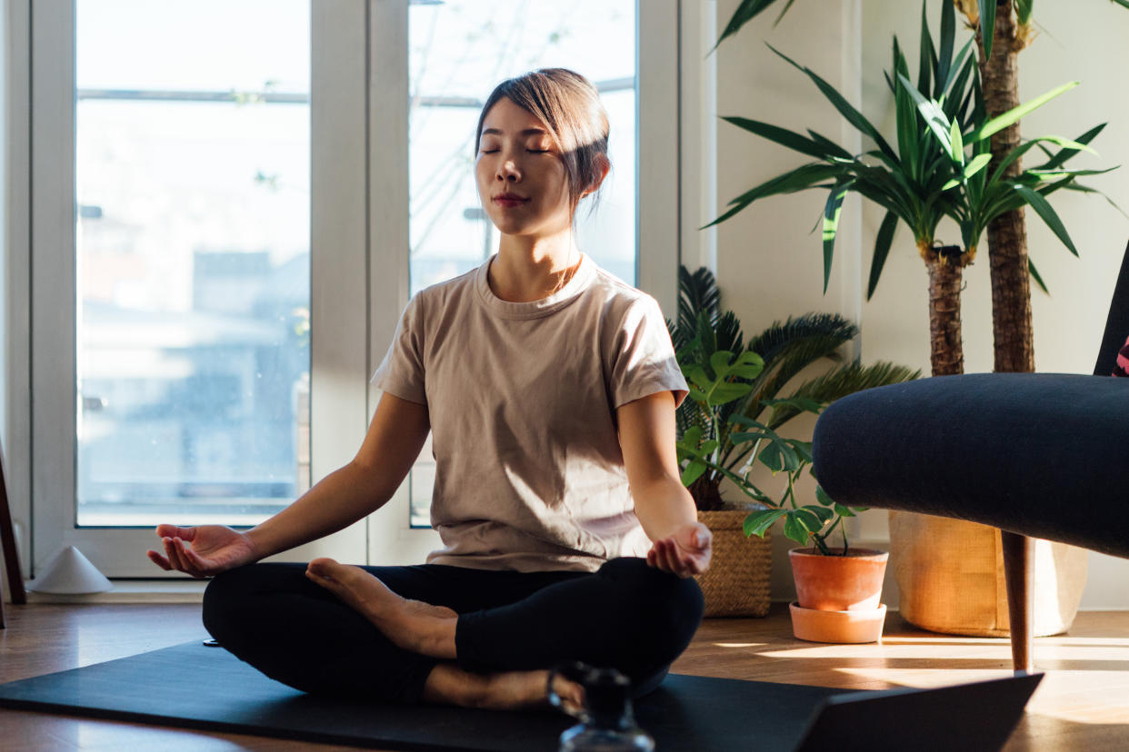 A woman meditating. (PHOTO: Getty Images)