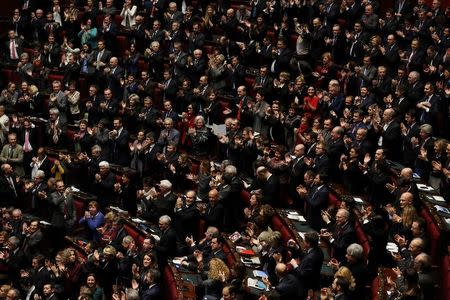 PD (Democratic Party) members celebrate after the election of the Italy's new President Sergio Mattarella, in the lower house of parliament in Rome, January 31, 2015. REUTERS/Alessandro Bianchi