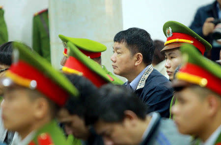 Vietnam's former Communist Party Politburo member and former chairman of PetroVietnam Dinh La Thang (C) listens during a verdict session at a court in Hanoi, Vietnam January 22, 2018. VNA/Doan Tan via REUTERS/Files