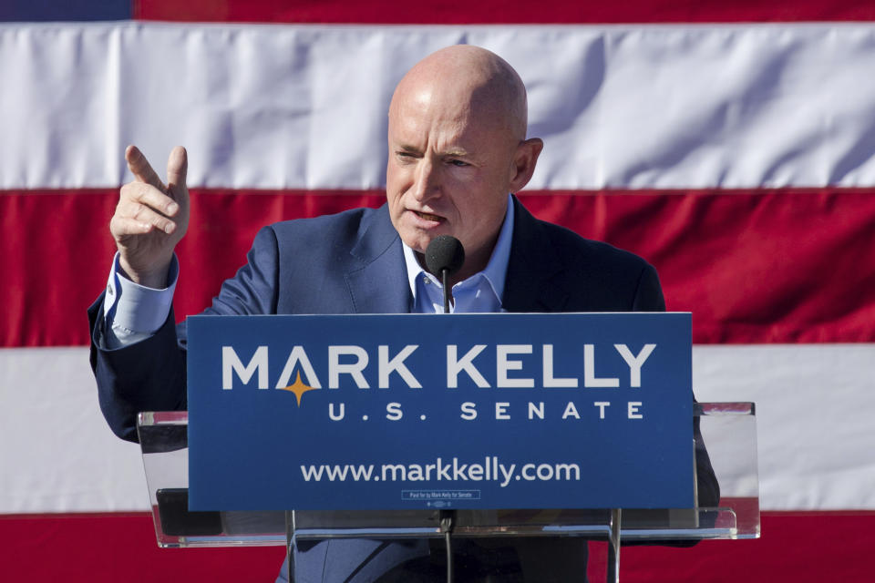 FILE - This Feb. 23, 2019, file photo shows Mark Kelly speaking during his senate campaign kickoff event in Tucson, Ariz. Kelly is using his background as an astronaut to entertain kids stuck at home. Martha McSally is volunteering at the Salvation Army. The global pandemic that is shaking up life is also forcing Arizona's U.S. Senate candidates to reinvent the political playbook when voters are much more concerned about staying healthy and paying the bills than they are with politics. (Mike Christy/Arizona Daily Star via AP, File)