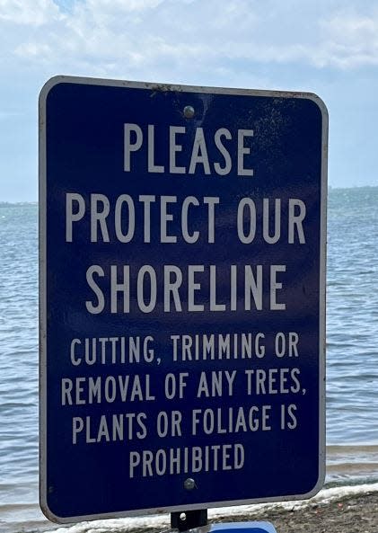 A sign posted along the Sarasota Bay waterfront green space that the Uplands neighborhood shares with New College of Florida.