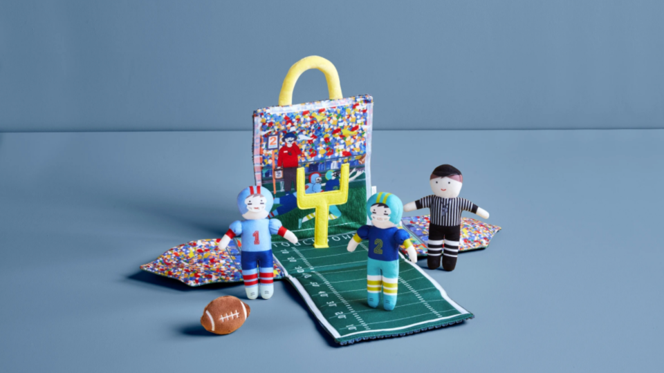 First Super Bowl outfits and toys: A fold-out plush stadium
