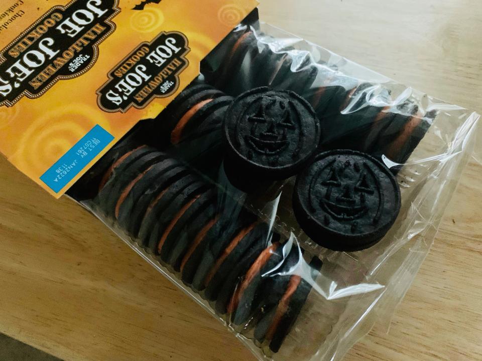 Open orange-and-black box of Trader Joe's halloween joe joes on a wooden table