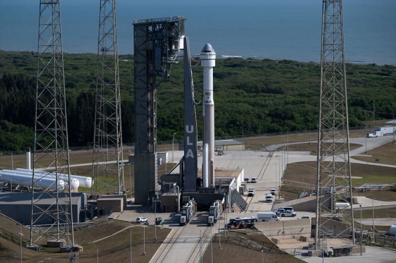 A United Launch Alliance Atlas V rocket with Boeing's CST-100 Starliner spacecraft aboard is rolled back to the Vertical Integration Facility to replace a pressure regulation valve on the Atlas V rocket at Cape Canaveral Space Force Station in Florida on Wednesday. NASA Photo by Joel Kowsky/UPI