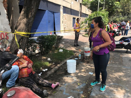 People are seen injured after an earthquake hit in Mexico City, Mexico September 19, 2017. REUTERS/Carlos Jasso