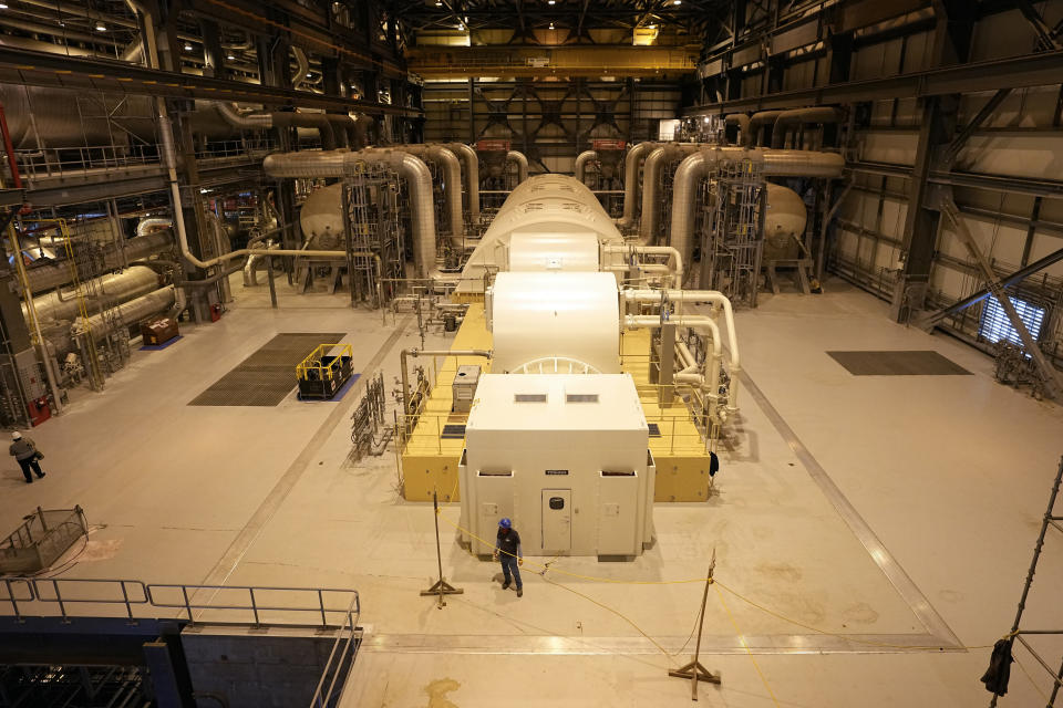 FILE - A turbine that generates electricity using steam heated by nuclear fission sits at Georgia Power Co.'s Plant Vogtle nuclear power plant on Jan. 20, 2023, in Waynesboro, Ga. Company officials announced Wednesday, May 24, 2023, that Unit 3, one of two new reactors at the site, would reach full power in coming days, after years of delays and billions in cost overruns. (AP Photo/John Bazemore, File)