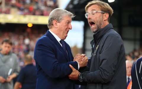 Crystal Palace Manager Roy Hodgson jokes with Liverpool Manager Jurgen Klopp - Credit: ACTION PLUS