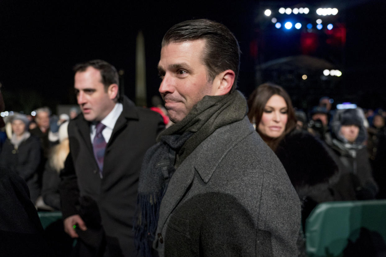 Donald Trump Jr., with Kimberly Guilfoyle behind, at the National Christmas Tree lighting ceremony in November. (Photo: Andrew Harnik/AP)