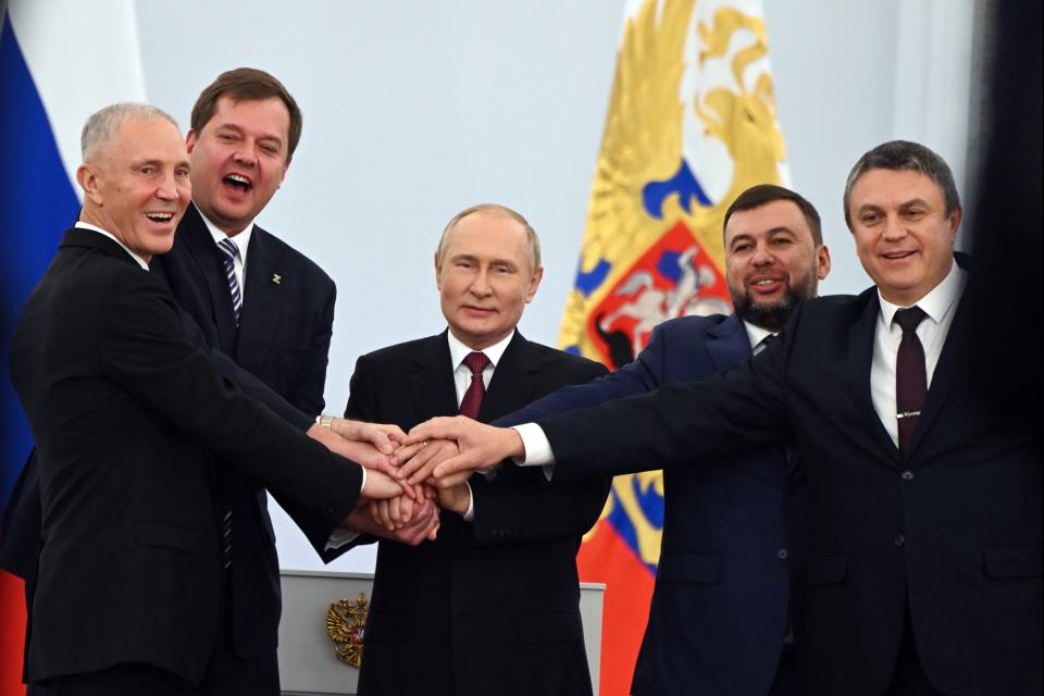 FILE - From left, Vladimir Saldo, the head of the Kherson region; Yevgeny Balitsky, the head of the Zaporizhzhia region; Russian President Vladimir Putin, center; Denis Pushilin, head of the self-proclaimed Donetsk People's Republic; and Leonid Pasechnik, head of the self-proclaimed Luhansk People's Republic, pose at a ceremony to sign treaties to illegally annex Ukrainian territories at the Kremlin in Moscow, on Friday, Sept. 30, 2022. Putin has argued that Ukrainians and Russians historically have always been one people, and that Ukraine's sovereignty is merely an illegitimate holdover from the Soviet era. In Russia, history has long become a propaganda tool used to advance the Kremlin's political goals. (Grigory Sysoyev, Sputnik, Kremlin Pool Photo via AP, File)
