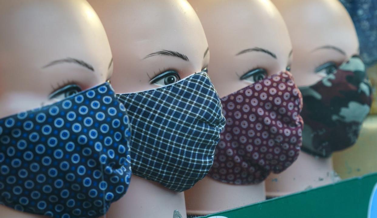 <span class="caption">Face masks are seen in the window of a shop during the COVID-19 pandemic in Montréal in December 2020.</span> <span class="attribution"><span class="source">THE CANADIAN PRESS/Paul Chiasson</span></span>