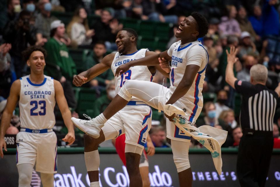 Colorado State basketball players Chandler Jacobs (13) and Isaiah Stevens celebrate during a game against the New Mexico Lobos at Moby Arena in Fort Collins on Wednesday.