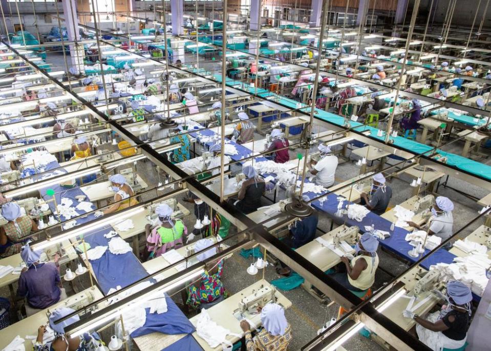 Factory workers are seen at the production unit for the production of personal protective equipment for COVID-19 coronavirus frontline health workers at a factory commissioned by the government, in Accra, on April 17, 2020.