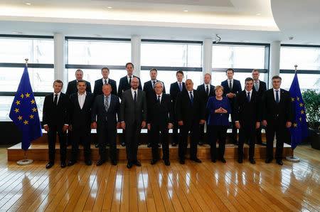 European Union leaders pose for a group photo at the start of an emergency European Union leaders summit on immigration at the EU Commission headquarters in Brussels, Belgium June 24, 2018. REUTERS/Yves Herman/Pool