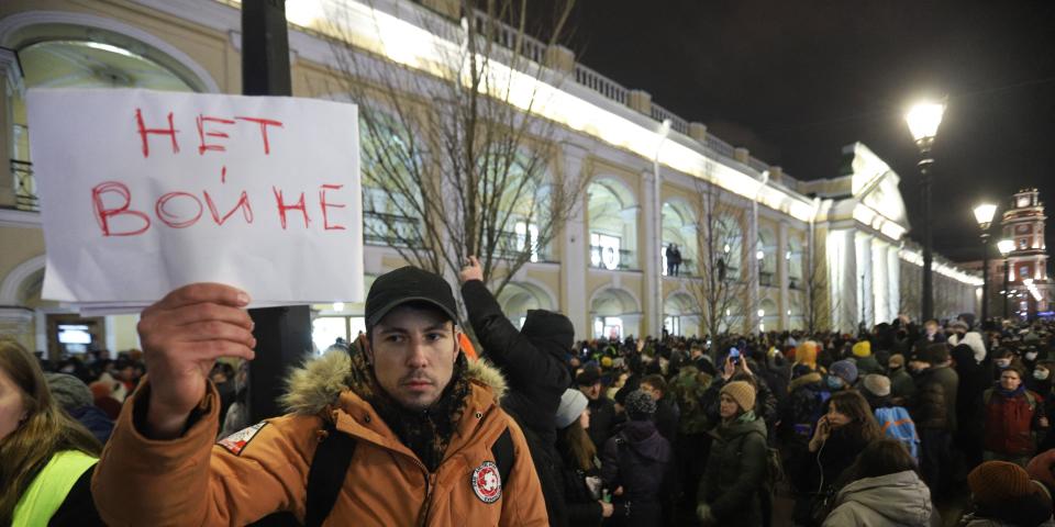 A demonstrator holding a placard reading "No to war" protests against Russia's invasion of Ukraine in central Saint Petersburg on February 24, 2022.