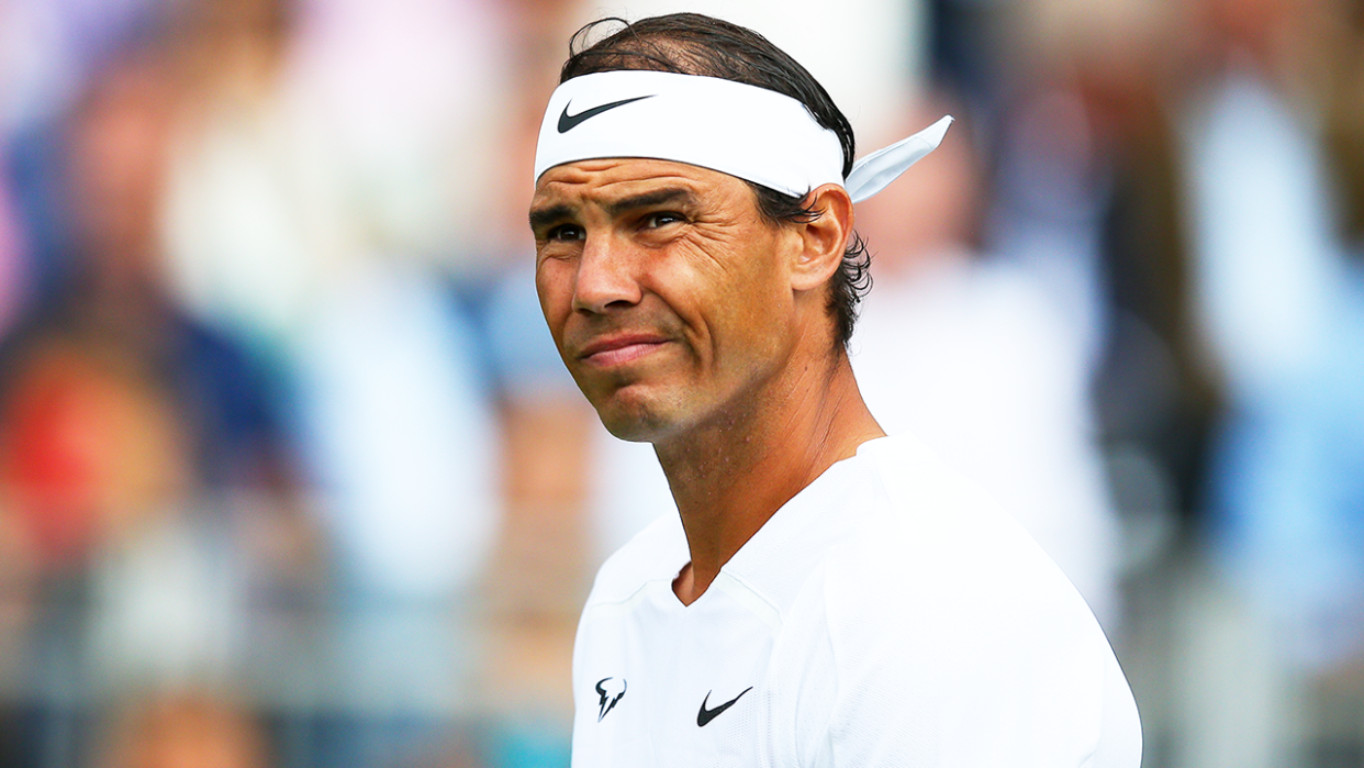 Rafa Nadal (pictured) reacts during a practice match before Wimbledon.