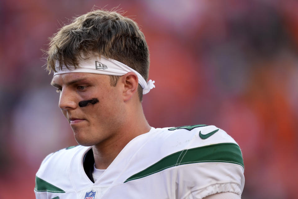 New York Jets quarterback Zach Wilson leaves the field after an NFL football game against the Denver Broncos , Sunday, Sept. 26, 2021, in Denver. The Broncos won 26-0. (AP Photo/David Zalubowski)