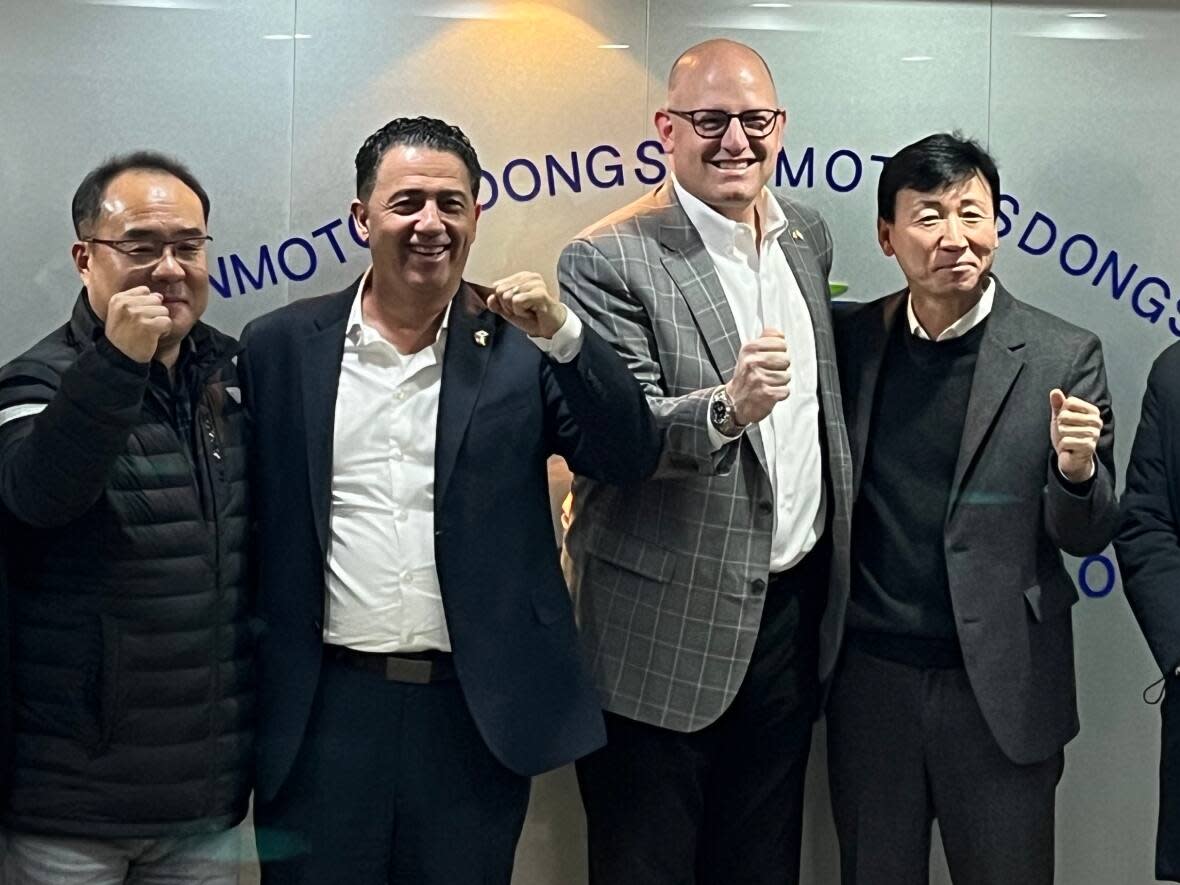 Windsor mayor Drew Dilkens in South Korea in December 2022, meeting with partners from Dongshin Motech for a facility tour.  (Drew Dilkens Twitter - image credit)