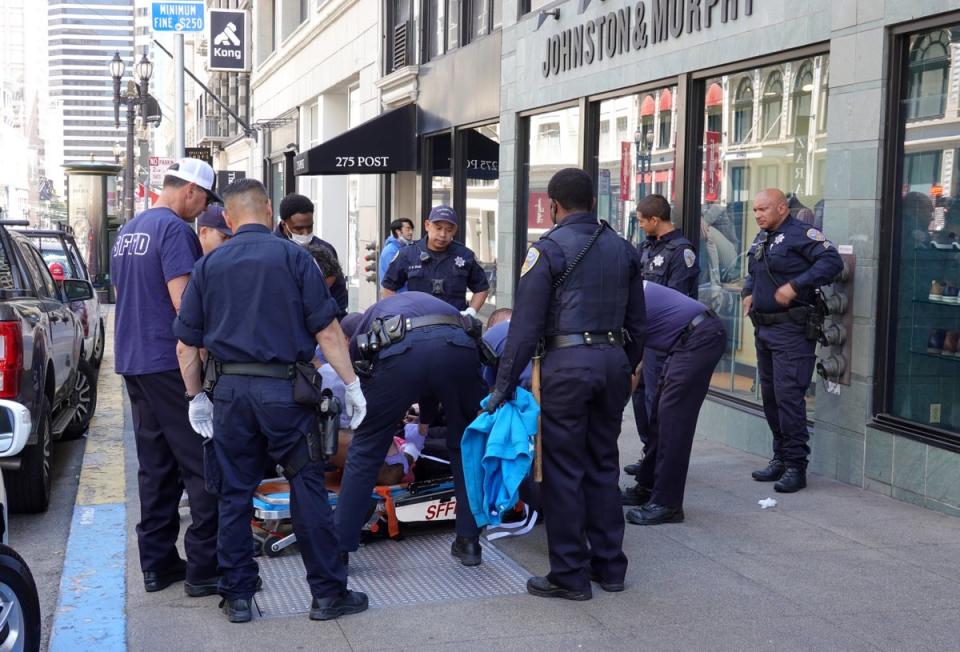 San Francisco police officers assist San Francisco firefighters during a medical call on May 24, 2022 in San Francisco, California (Getty Images)