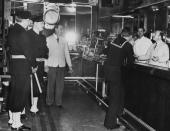 <p>This shot gives us a cool look at some old school Navy uniforms and other fashion around the 1900s in New York.</p>