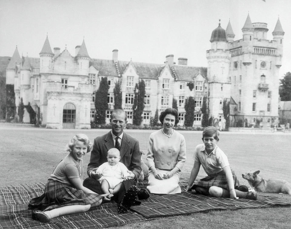 <p>The current Queen of the United Kingdom had two of her four children — Prince Andrew and Prince Edward — during her reign. She is seen here on the grounds of Balmoral Castle with Prince Charles, Princess Anne, and Prince Philip, who holds baby Prince Andrew on his lap. (Photo: Getty Images) </p>