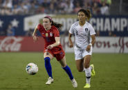 File-This Oct. 3, 2019, file photo shows United State's Rose Lavelle, left, dribbles past South Korea's Cho So-hyun, right, during a soccer match in Charlotte, N.C. Lavelle scored a goal in a World Cup final win over the Netherlands. Could be a big factor for the Americans at the Tokyo Games. (AP Photo/Mike McCarn, File)