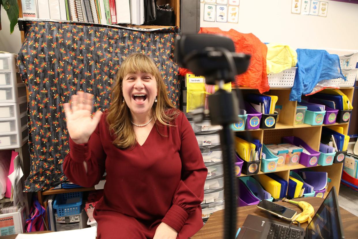 Kindergarten teacher Carrie Mook interacts with her class on a video camera at J. Graham Brown school on Jan. 11, 2022, as the first day of non-traditional instruction began in JCPS.