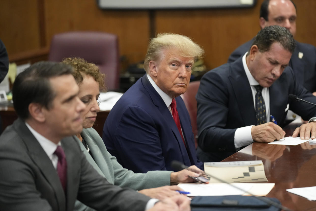 Former President Donald Trump sits at the defense table inside criminal court in Manhattan on April 4. (Seth Wenig/AP, Pool)