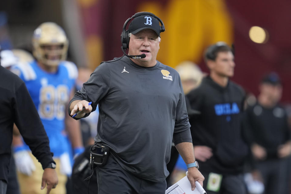 UCLA head coach Chip Kelly stands on the sideline during the first half of an NCAA college football game against Southern California in Los Angeles, Saturday, Nov. 18, 2023. (AP Photo/Ashley Landis)