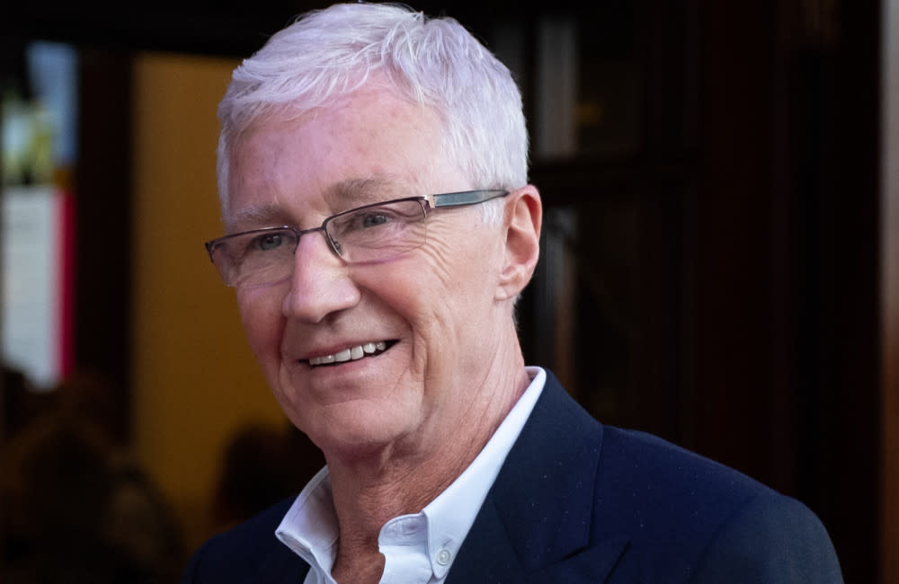 Paul O'Grady was being 'nuzzled' by his beloved dog as he died credit:Bang Showbiz