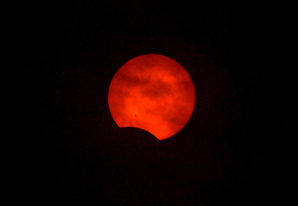 The moon crosses in front of the sun during an annular solar eclipse on Oct. 14, 2023 in Lake View, Oregon. / Credit: Nick Ut / Getty Images