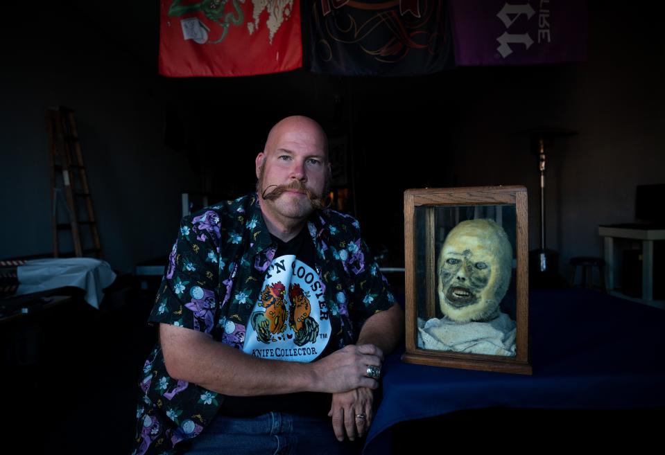 The head of the Beast of Sugar Flats Road is kept under lock and key encased in glass and wood at Sterling Buster's Lebanon, Tenn., man cave. The taxidermied head's hair has turned from brown to yellow after sitting in a shop's window for a few years.