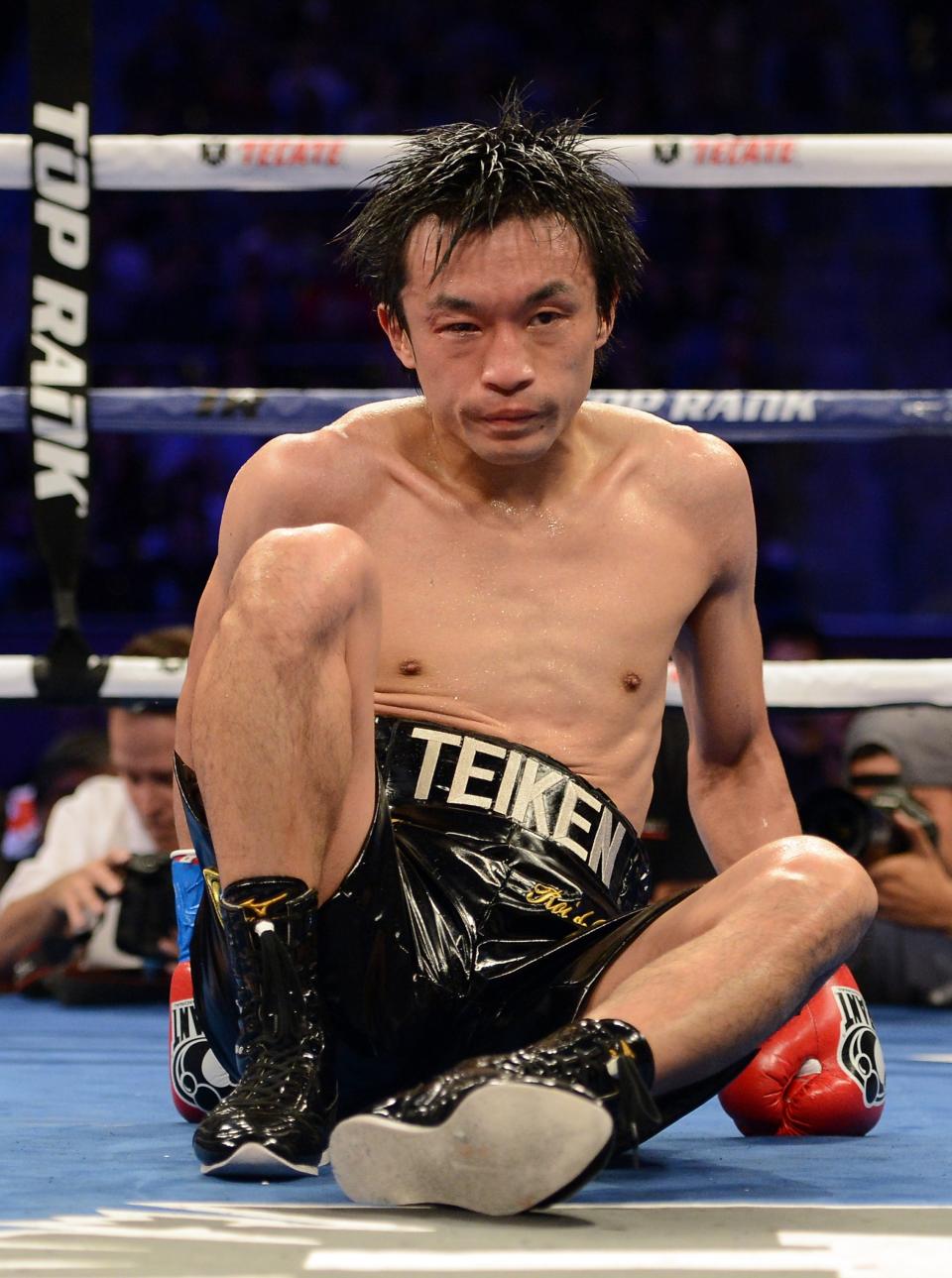 CARSON, CA - OCTOBER 13: Toshioka Nishioka of Japan is knocked down by Nonito Donaire of The Phillipines in the sixth round during the WBO Super Bantamweight Title fight at The Home Depot Center on October 13, 2012 in Carson, California. Donaire would win the fight with a ninth round TKO. (Photo by Harry How/Getty Images)