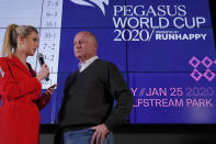 Race horse Omaha Beach's trainer Richard Mandella, right, is interviewed by racing analyst Acacia Courtney during the draw for the Pegasus World Cup Horse Race, Wednesday, Jan. 22, 2020, in Hallandale Beach, Fla. The race will run Saturday, Jan. 25 at Gulfstream Park in Hallandale Beach. (AP Photo/Wilfredo Lee)