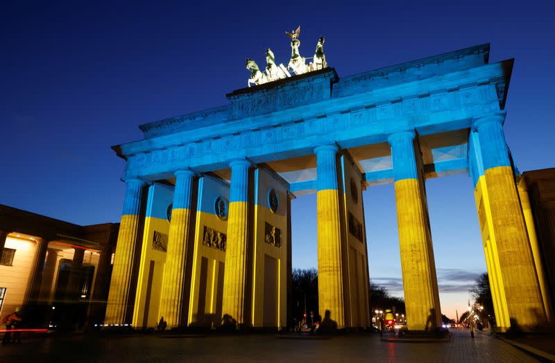 Brandenburg Gate is illuminated in Ukrainian national colors, in Berlin
