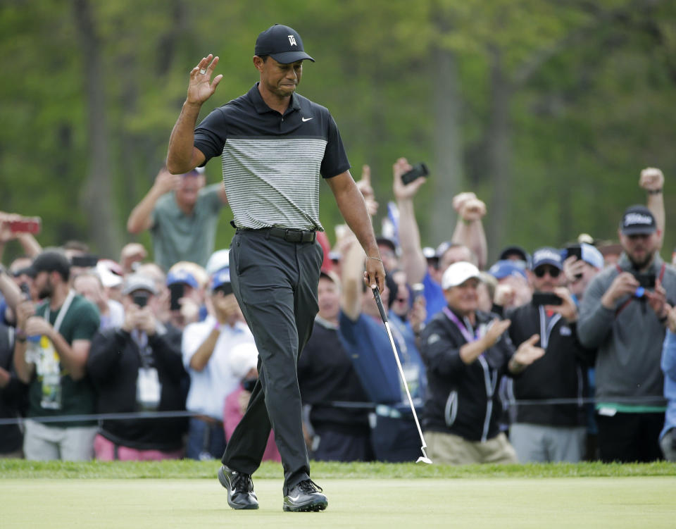 Tiger Woods reacts after sinking a putt for birdie on the ninth green during the second round of the PGA Championship golf tournament, Friday, May 17, 2019, at Bethpage Black in Farmingdale, N.Y. 