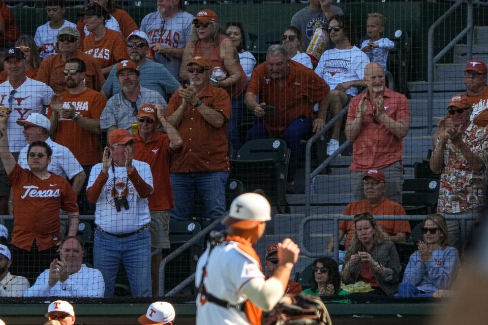 Texas fans cheer for catcher Rylan Galvan after he tagged out a Cal Poly runner at the plate during the Longhorns' 7-0 win Sunday at UFCU Disch-Falk Field. The Longhorns have opened the season 6-1 after starting with seven straight home games.