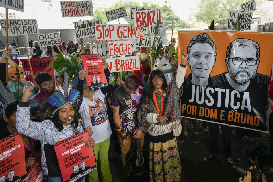 Guarani Indigenous and human rights activists attend a demonstration in support of British journalist Dom Phillips and Indigenous expert Bruno Perreira, demanding authorities conduct a thorough investigation into the circumstances leading to their deaths, and do more to protect indigenous lands against illegal miners, loggers, and fishermen, in Sao Paulo, Brazil, Saturday, June 18, 2022. (AP Photo/Andre Penner)