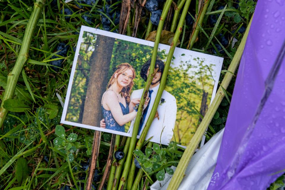 A photo of Dunlap High School senior Nevaeh Mitchell, 18, of Princeville, and her prom date Tristan Charbonnel, is part of a memorial of flowers, stuffed animals, and heartfelt letters lying along Orange-Prairie Road in North Peoria. Mitchell was killed in a car accident on the road Sunday, May 5, 2024.